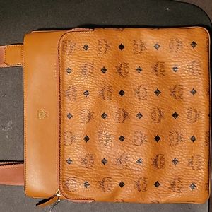 Original MCM crossbody bag slim fit inside separate compartment on the outer zip